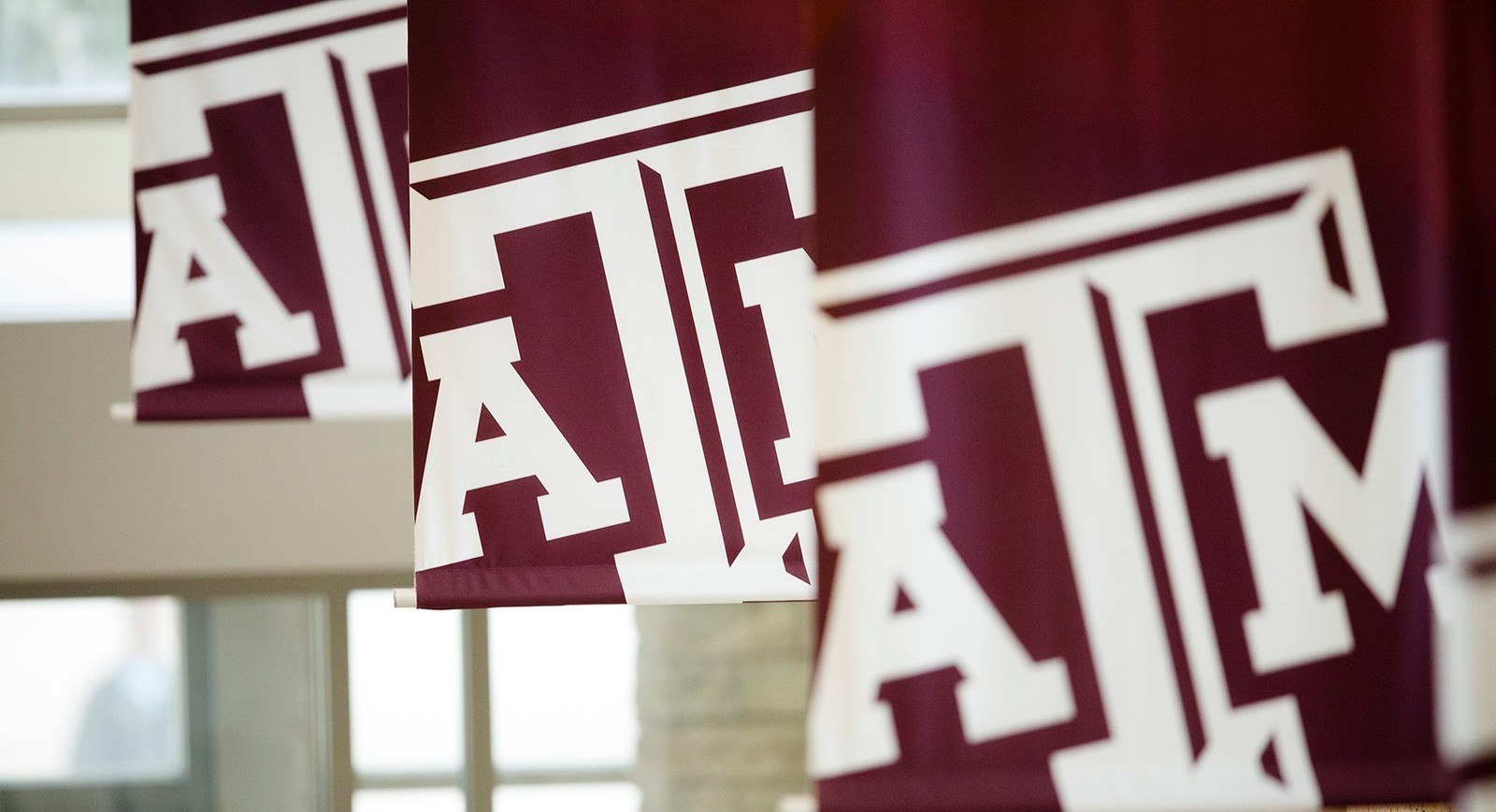 Maroon banners with A&M logos hanging in MSC