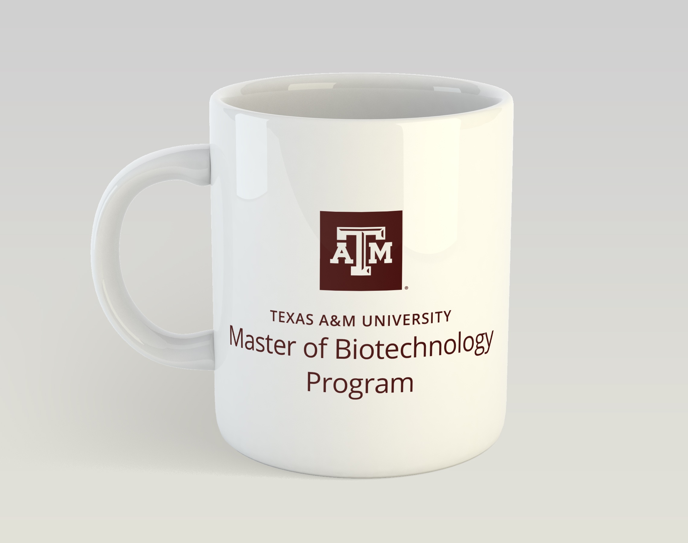 A maroon A&M logo on a white mug